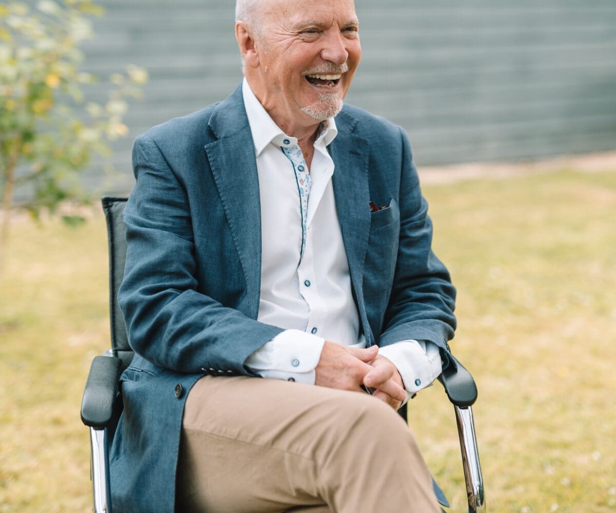 Brian Marriott of Marriott Design and WightAID, seated and laughing